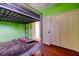 Bedroom with bunk beds, closet, and wood laminate flooring at 12628 White Bluff Rd, Hudson, FL 34669