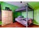 Bedroom with bunk beds, wooden dresser, and wood laminate floors at 12628 White Bluff Rd, Hudson, FL 34669