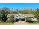 Community clubhouse with pool access, landscaping, and manicured gardens at 12628 White Bluff Rd, Hudson, FL 34669