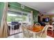 Cozy dining area with access to the patio and outdoor grill at 12628 White Bluff Rd, Hudson, FL 34669