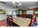 A combination dining and living area with a view into the kitchen at 12628 White Bluff Rd, Hudson, FL 34669