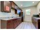 A bright and clean kitchen area featuring stainless steel appliances, granite countertops, and plenty of cabinet space at 12628 White Bluff Rd, Hudson, FL 34669