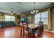 A combined living and dining area with wood floors and a ceiling fan at 12628 White Bluff Rd, Hudson, FL 34669