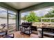 Relaxing screened patio complete with an outdoor kitchen and grill at 12628 White Bluff Rd, Hudson, FL 34669
