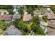 Aerial view of a property featuring a well-maintained lawn and surrounding greenery at 12806 Castlemaine Dr, Tampa, FL 33626