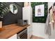Stylish bar area featuring custom cabinetry, a wine cooler, and designer touches at 12806 Castlemaine Dr, Tampa, FL 33626
