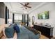 Comfortable bedroom showcasing a tray ceiling, large window, and stylish decor at 12806 Castlemaine Dr, Tampa, FL 33626