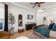 Serene bedroom featuring a tray ceiling, a sitting area, and ample natural light at 12806 Castlemaine Dr, Tampa, FL 33626