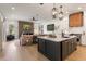 Open-concept kitchen with a center island, modern appliances, and seamless flow to the living area at 12806 Castlemaine Dr, Tampa, FL 33626