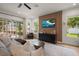 Bright living room with natural light, a feature wall, and comfortable seating at 12806 Castlemaine Dr, Tampa, FL 33626