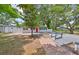 Beautiful home exterior boasting a red front door, well-manicured yard, and brick pathway enhancing curb appeal at 13110 Mitchell St, Tampa, FL 33612