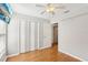 Bright bedroom with a ceiling fan, closet, and a doorway leading to another room at 1333 Dragon Head Dr, Valrico, FL 33594