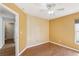 Bedroom featuring a decorative accent wall, ceiling fan, neutral paint color, and a window with blinds at 1333 Dragon Head Dr, Valrico, FL 33594