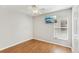 Bedroom features a ceiling fan, a window with blinds, and a mounted television at 1333 Dragon Head Dr, Valrico, FL 33594
