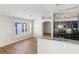 Open-concept kitchen with granite counters, stainless appliances, and hardwood floors at 1333 Dragon Head Dr, Valrico, FL 33594