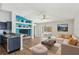 Bright living room featuring vaulted ceilings, contemporary decor, and access to outdoor pool at 1333 Dragon Head Dr, Valrico, FL 33594