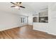 Spacious living room adjacent to the kitchen featuring sleek laminate flooring and ample natural light at 1333 Dragon Head Dr, Valrico, FL 33594