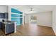 Bright living room featuring vaulted ceilings, contemporary decor, and access to outdoor pool at 1333 Dragon Head Dr, Valrico, FL 33594