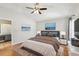 Spacious main bedroom suite featuring vaulted ceilings, hardwood floors, and stylish decor at 1333 Dragon Head Dr, Valrico, FL 33594