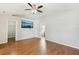 Spacious main bedroom with hardwood floors and ensuite bathroom entrances at 1333 Dragon Head Dr, Valrico, FL 33594