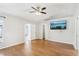 Spacious main bedroom with hardwood floors and ensuite bathroom entrances at 1333 Dragon Head Dr, Valrico, FL 33594