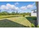Inviting backyard featuring a serene pond view, perfect for enjoying nature and peaceful moments at 13981 Lilac Sky Ter, Bradenton, FL 34211