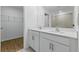 Bathroom features dual sinks with modern fixtures and a walk in closet at 13981 Lilac Sky Ter, Bradenton, FL 34211