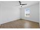 Bedroom featuring wood floors and a bright window at 13981 Lilac Sky Ter, Bradenton, FL 34211