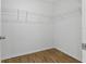 Walk in closet with laminate flooring and wire shelving at 13981 Lilac Sky Ter, Bradenton, FL 34211