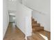 Bright foyer featuring hardwood floors and a staircase leading upstairs at 13981 Lilac Sky Ter, Bradenton, FL 34211