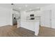 Bright and modern kitchen with stainless steel appliances and large central island at 13981 Lilac Sky Ter, Bradenton, FL 34211