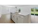 Kitchen island with stainless steel dishwasher and views of the backyard at 13981 Lilac Sky Ter, Bradenton, FL 34211