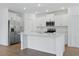 Well-lit kitchen featuring stainless steel appliances, island and ample cabinet space at 13981 Lilac Sky Ter, Bradenton, FL 34211