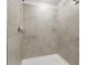 A fully tiled shower stall with a sleek design and modern showerhead at 13981 Lilac Sky Ter, Bradenton, FL 34211
