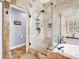 Modern bathroom with glass shower, separate tub, and access to another room at 1424 Ridge Shore Dr, Tarpon Springs, FL 34689
