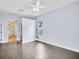 An empty bedroom features tiled floors, a ceiling fan, and an ensuite bathroom at 1424 Ridge Shore Dr, Tarpon Springs, FL 34689