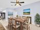 Dining room with a large table, neutral colors, and artwork at 1424 Ridge Shore Dr, Tarpon Springs, FL 34689
