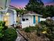 Charming entryway featuring lush landscaping and stone groundcover, leading to an inviting doorway at 1424 Ridge Shore Dr, Tarpon Springs, FL 34689