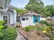Charming home exterior with manicured landscaping, decorative planters, and cozy curb appeal at 1424 Ridge Shore Dr, Tarpon Springs, FL 34689