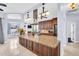 Spacious kitchen with granite countertops, stainless steel appliances, and an open layout to living areas at 1424 Ridge Shore Dr, Tarpon Springs, FL 34689