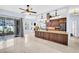 Spacious kitchen with an island, stainless steel appliances, and access to the outdoor patio at 1424 Ridge Shore Dr, Tarpon Springs, FL 34689