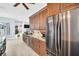 Bright kitchen featuring granite countertops, stainless steel appliances, and ample cabinet space at 1424 Ridge Shore Dr, Tarpon Springs, FL 34689