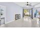 Bright living room with tile floors and sliding glass doors to an outdoor patio at 1424 Ridge Shore Dr, Tarpon Springs, FL 34689