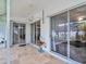 Covered patio with tiled flooring and ceiling fan, seamlessly connecting indoor and outdoor living spaces at 1424 Ridge Shore Dr, Tarpon Springs, FL 34689