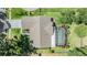 Aerial view of a home with a screen enclosed pool and a well maintained backyard at 16214 W Course Dr, Tampa, FL 33624