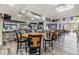 The Clubhouse bar features stone accents, modern lighting, and barstool seating at 16214 W Course Dr, Tampa, FL 33624