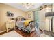 Comfortable bedroom featuring natural light, stylish decor, and hardwood floors at 16214 W Course Dr, Tampa, FL 33624