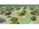 Scenic aerial view of the community golf course featuring lush fairways and manicured greens at 16214 W Course Dr, Tampa, FL 33624