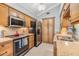 Charming kitchen featuring ample cabinets and stainless steel appliances at 16214 W Course Dr, Tampa, FL 33624