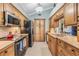 Spacious kitchen with stainless steel appliances and ample counter space at 16214 W Course Dr, Tampa, FL 33624